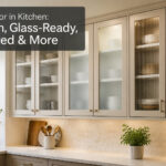A bright kitchen with multiple glass cabinet doors and elegant decor.