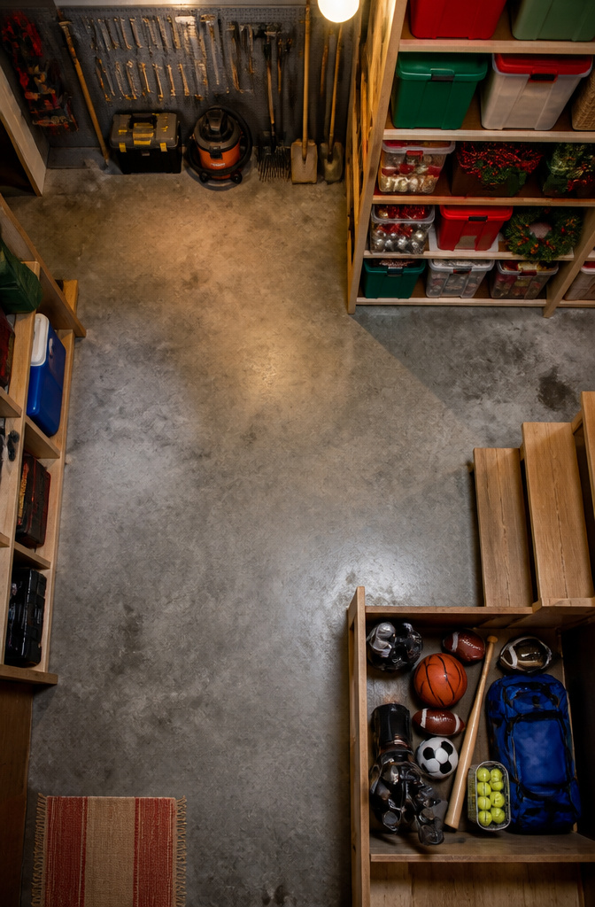 Different storage zones marked in a neatly organized basement.